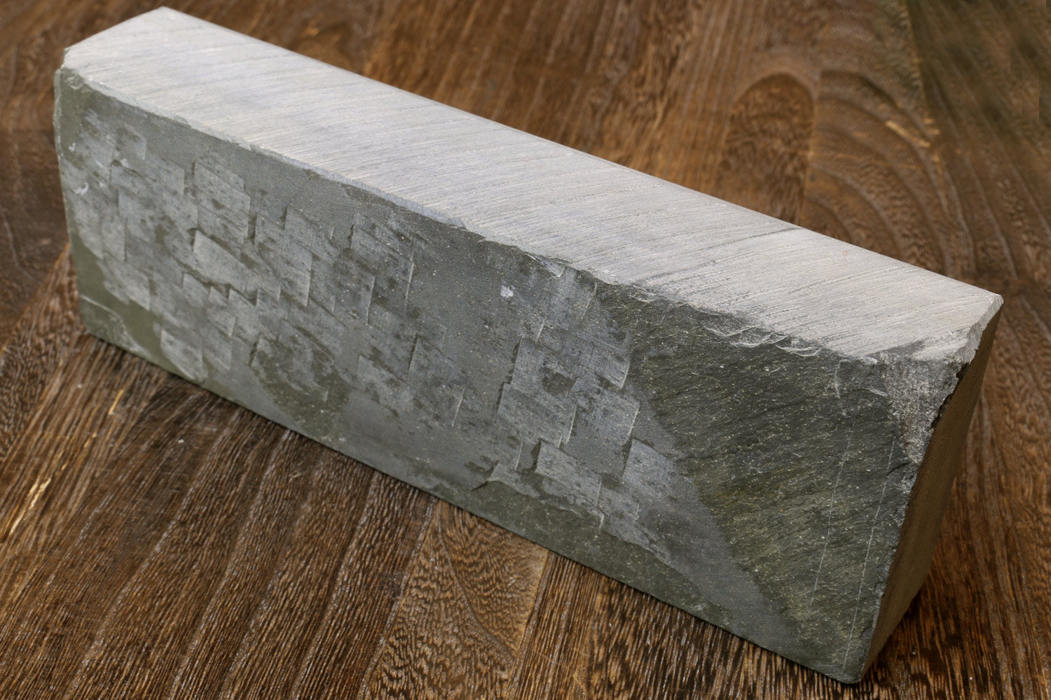 Rectangular natural sharpening whetstone, pale gray, side view