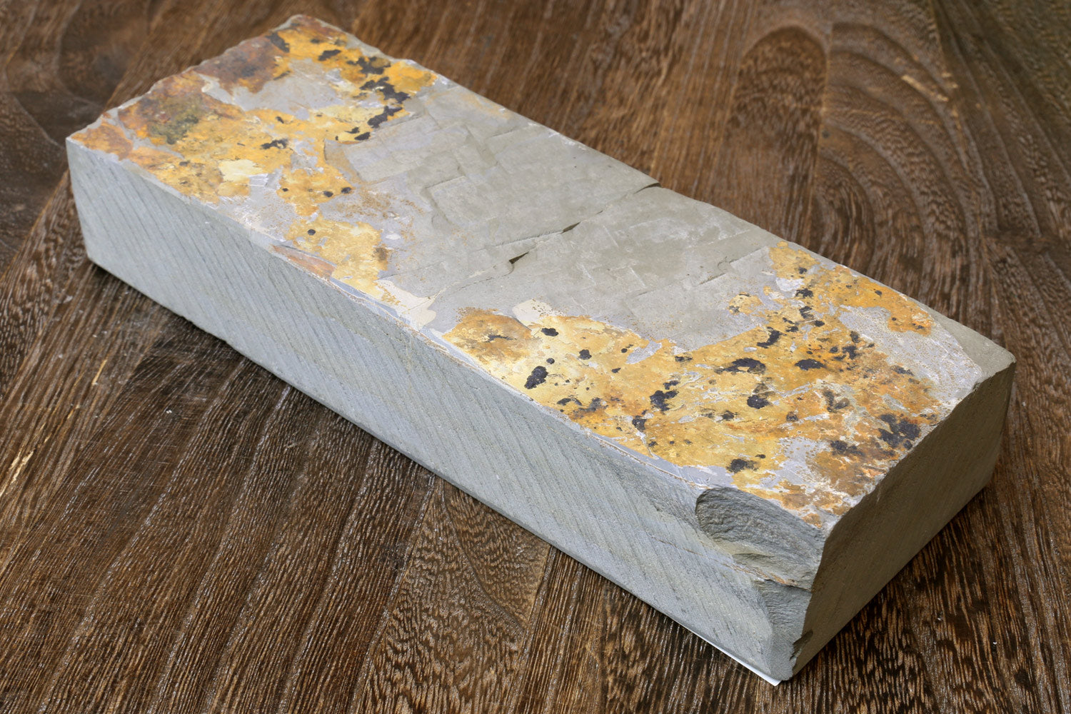 Natural sharpening whetstone finishing stone, off-white with yellow and dark speckles