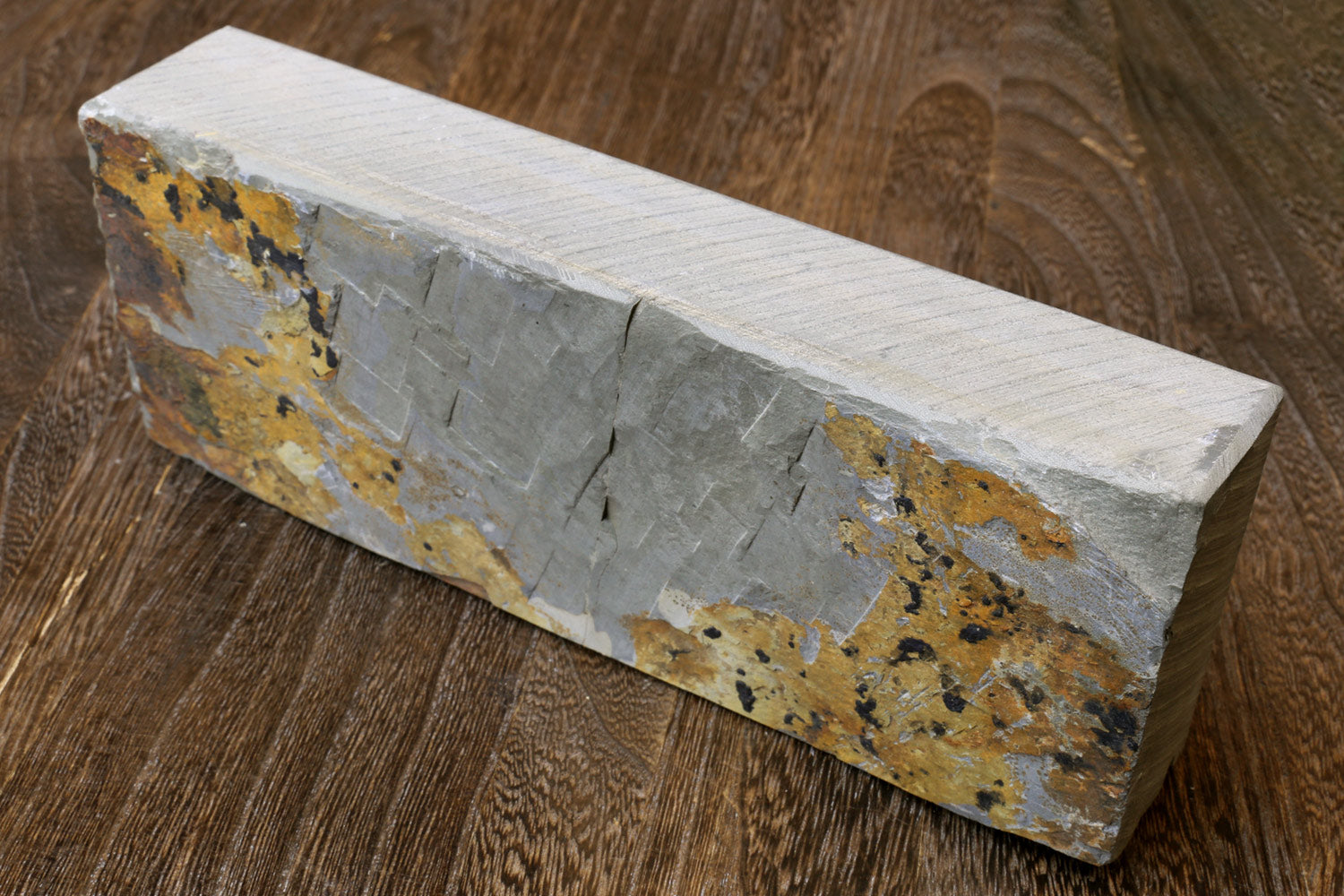 Natural sharpening whetstone finishing stone, pale stone with yellow flecks and dark spots