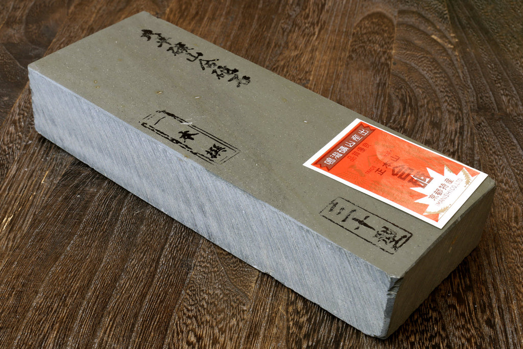 Natural whetstone sharpening finishing stone, rectangular gray stone block with label
