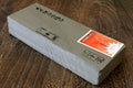 Natural whetstone sharpening finishing stone, rectangular gray stone block with label