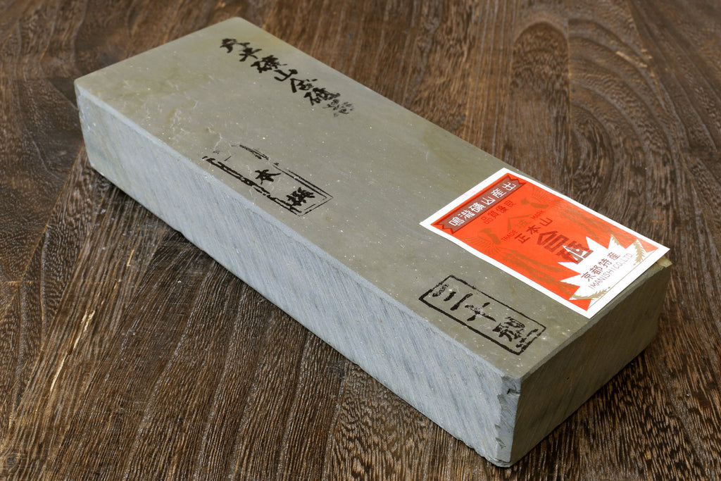 Natural whetstone finishing stone, cream rectangular block with end labels