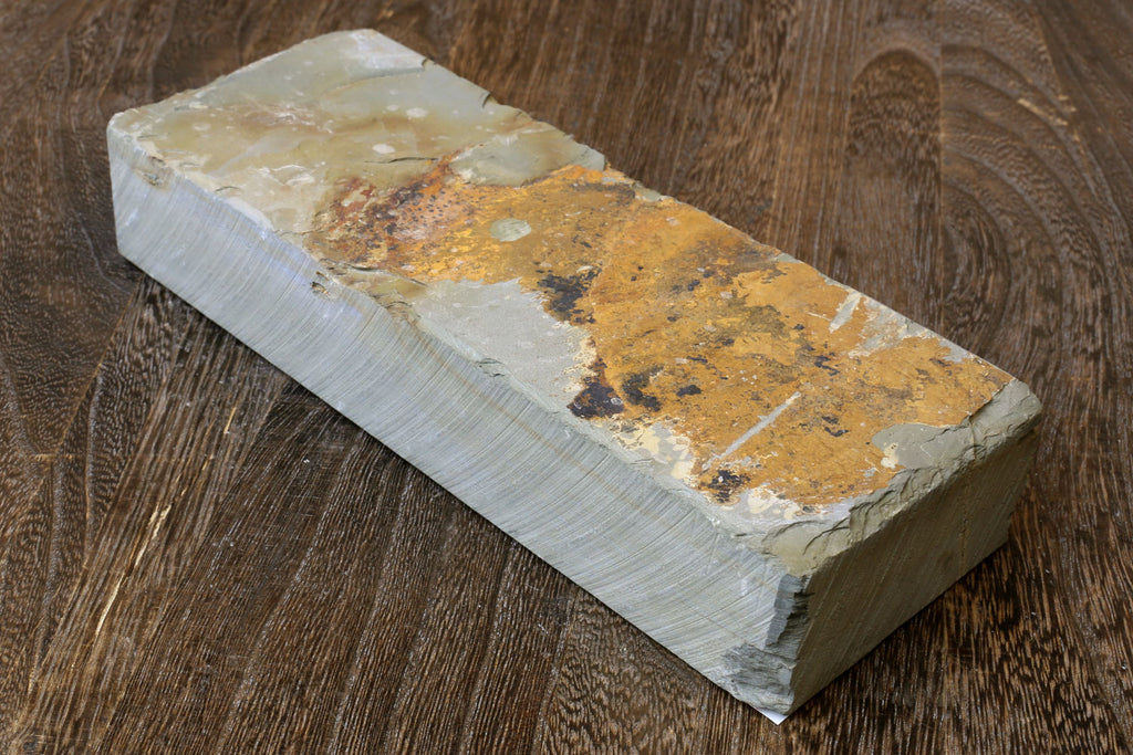 Natural whetstone block, pale sides with worn tan speckled sharpening surface