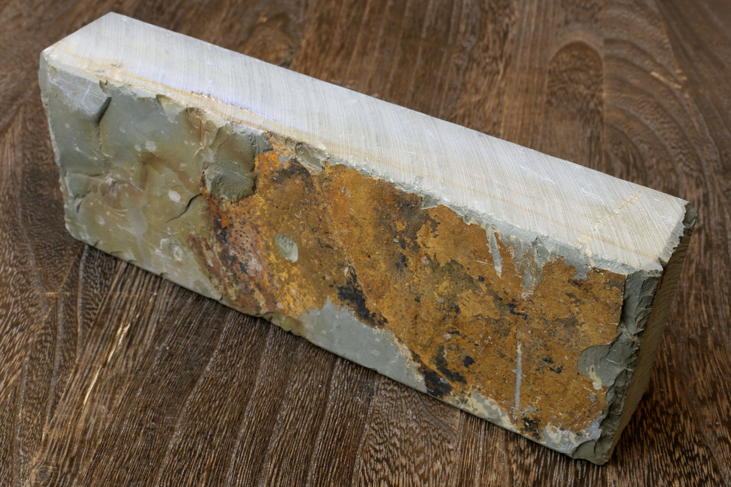 Natural sharpening whetstone, pale white slab with mottled tan and gray surface