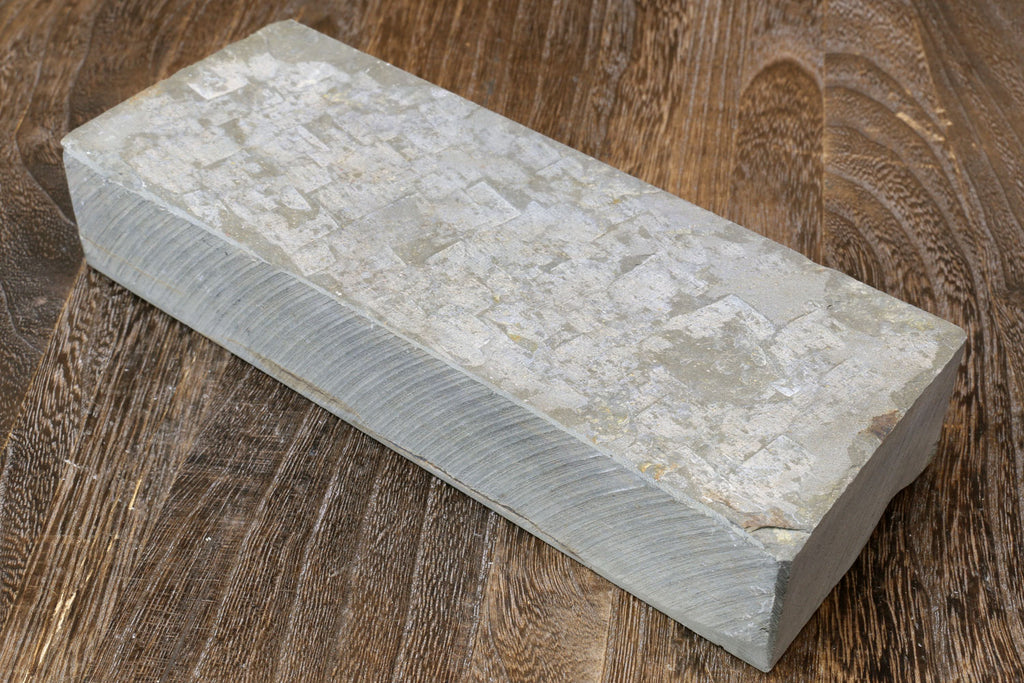 Natural sharpening whetstone block, pale white speckled surface