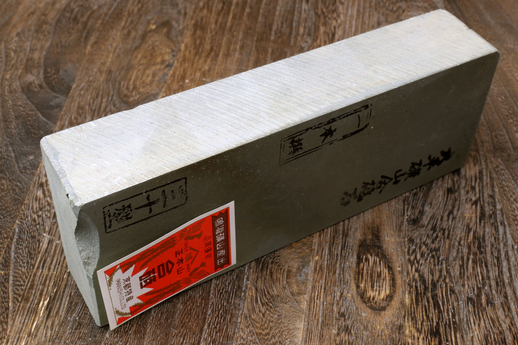 Natural sharpening whetstone block with side labels on dark strip