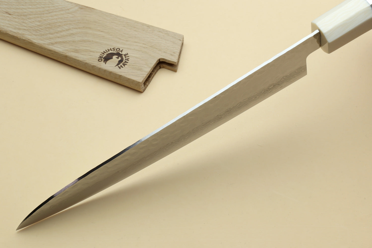 Japanese chef’s gyuto knife with pointed tip and Damascus blade