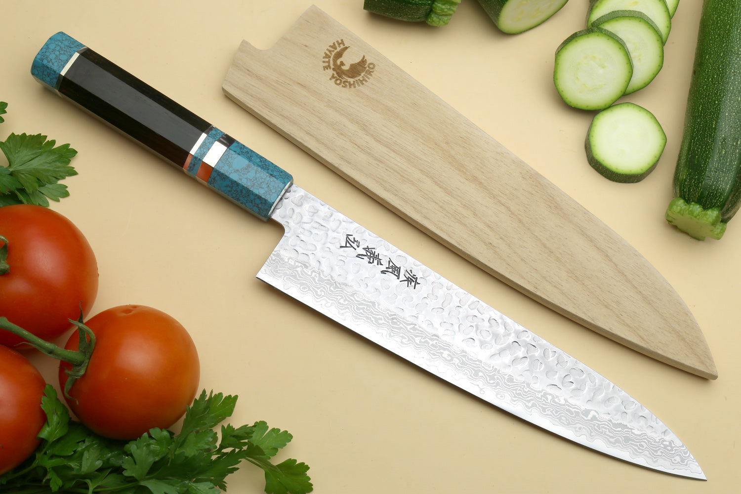 Chef's gyuto knife with hammered Damascus blade and turquoise blue octagonal handle
