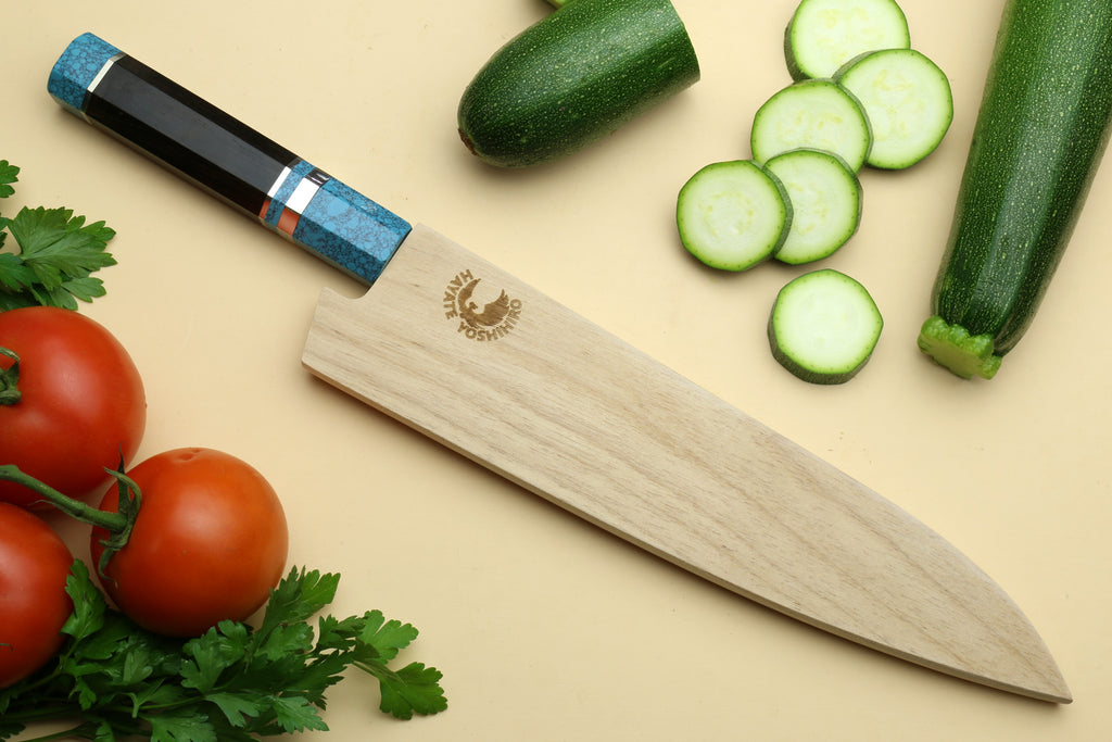 Chef's gyuto knife with turquoise handle and light wood sheath