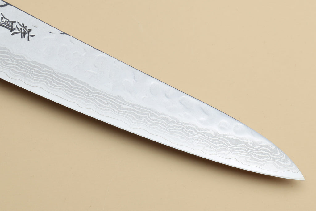 Yoshihiro VG-10 petty knife blade close-up, hammered Damascus edge profile