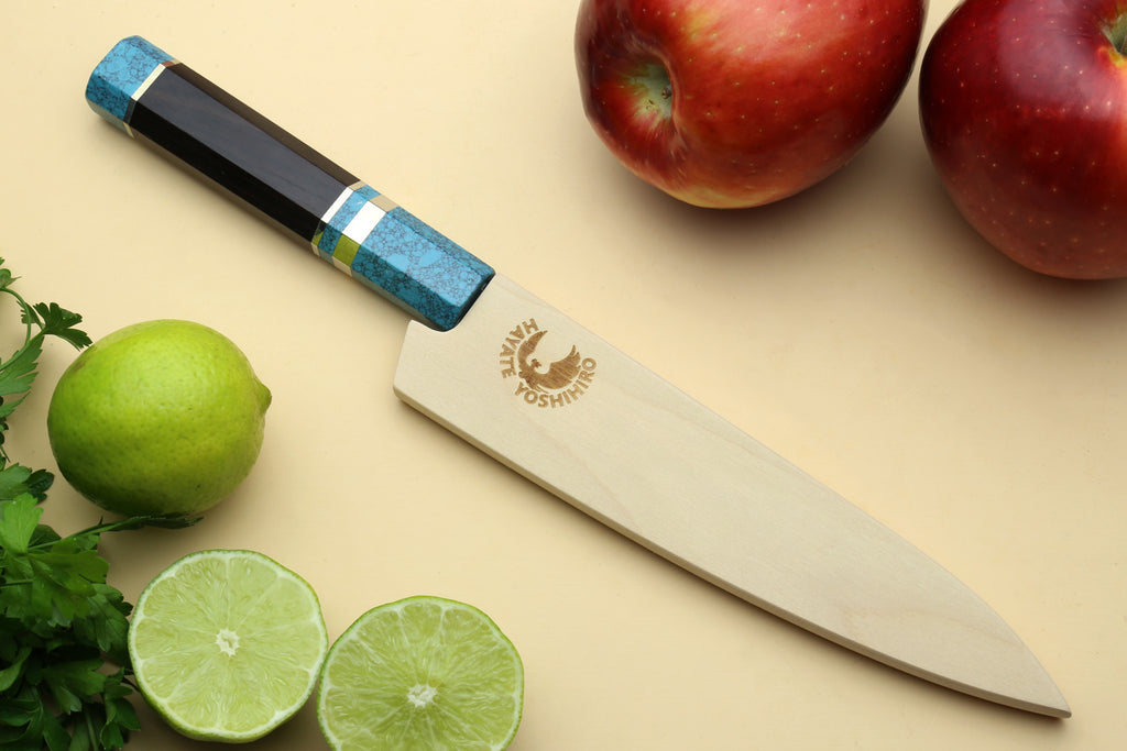 Petty utility knife with Damascus blade, turquoise handle, and brand logo near bolster.