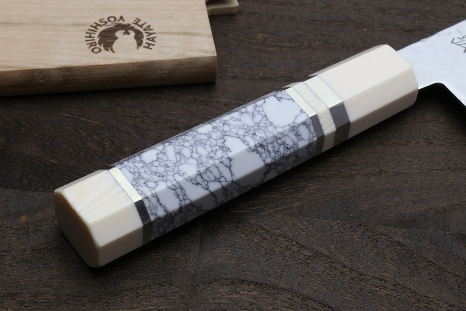 Howlite white santoku handle with marbled pattern, ivory-toned bolster, damascus blade