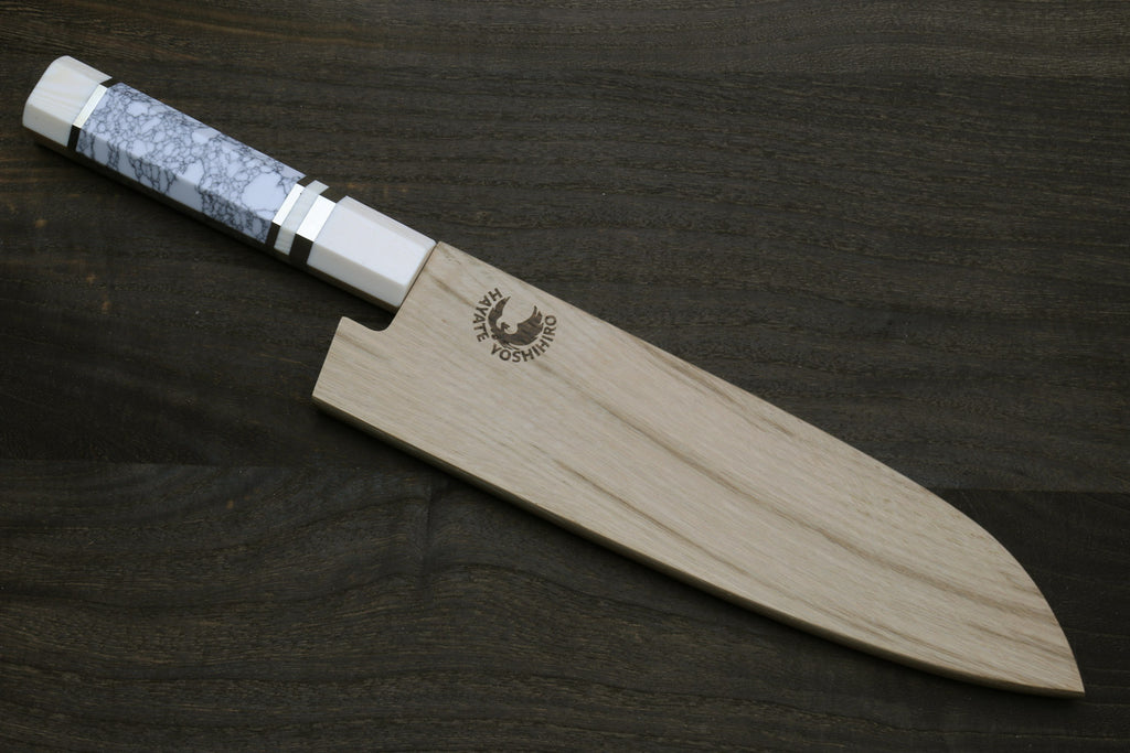 Damascus santoku knife with white howlite handle and ivory-toned bolster, in wooden sheath