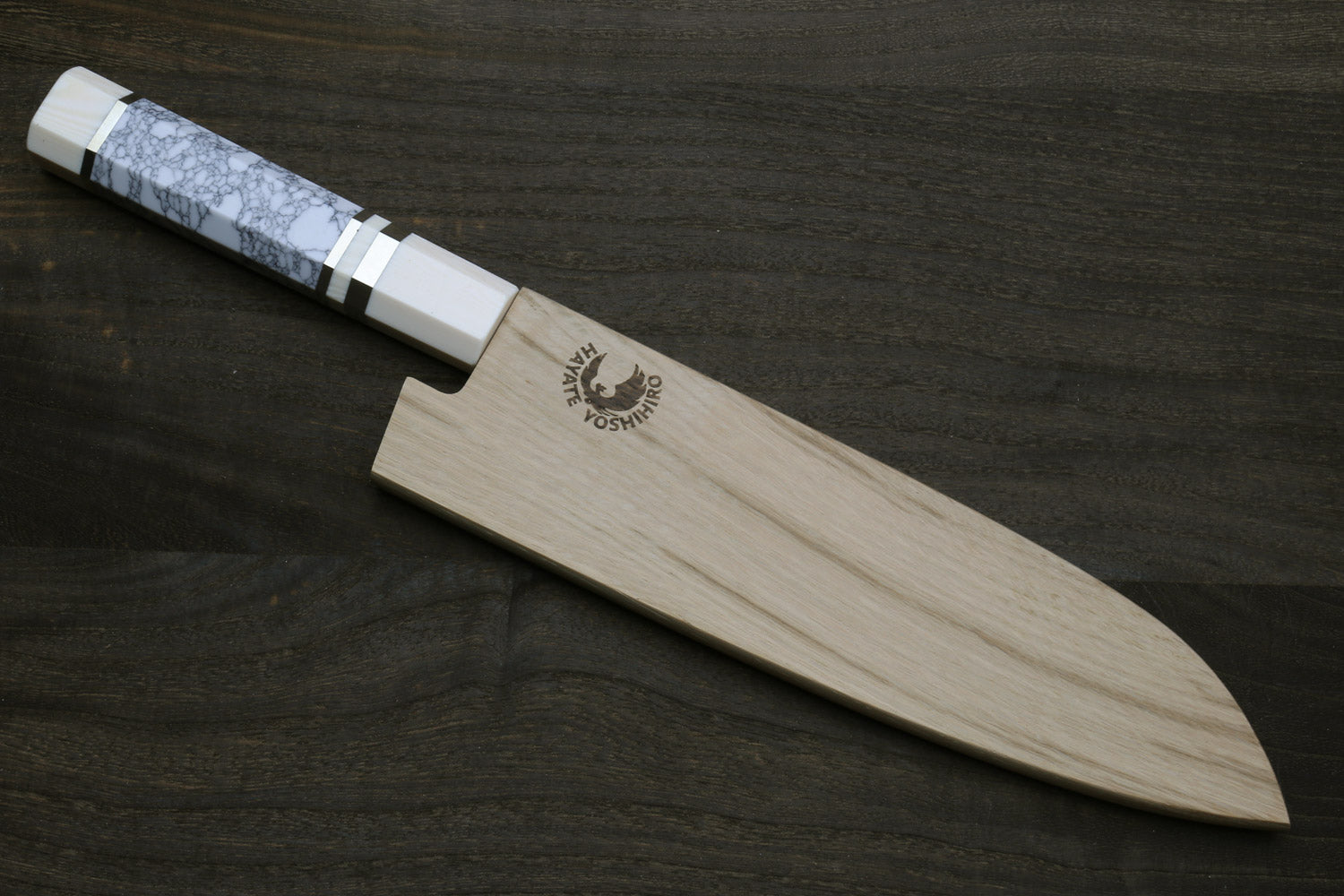 Damascus santoku knife with white howlite handle and ivory-toned bolster, in wooden sheath