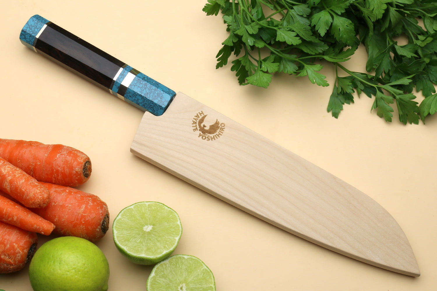 Santoku knife with wooden sheath, turquoise blue octagonal handle, and Damascus blade