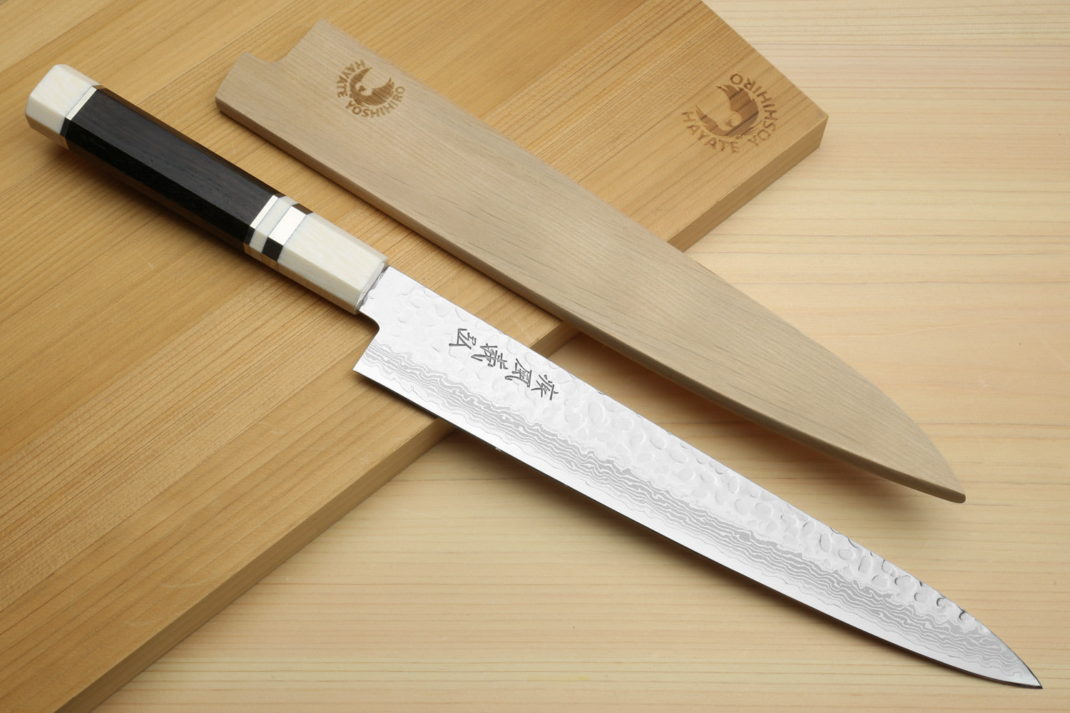 Japanese sujihiki slicer knives with damascus blades and ivory and black handles