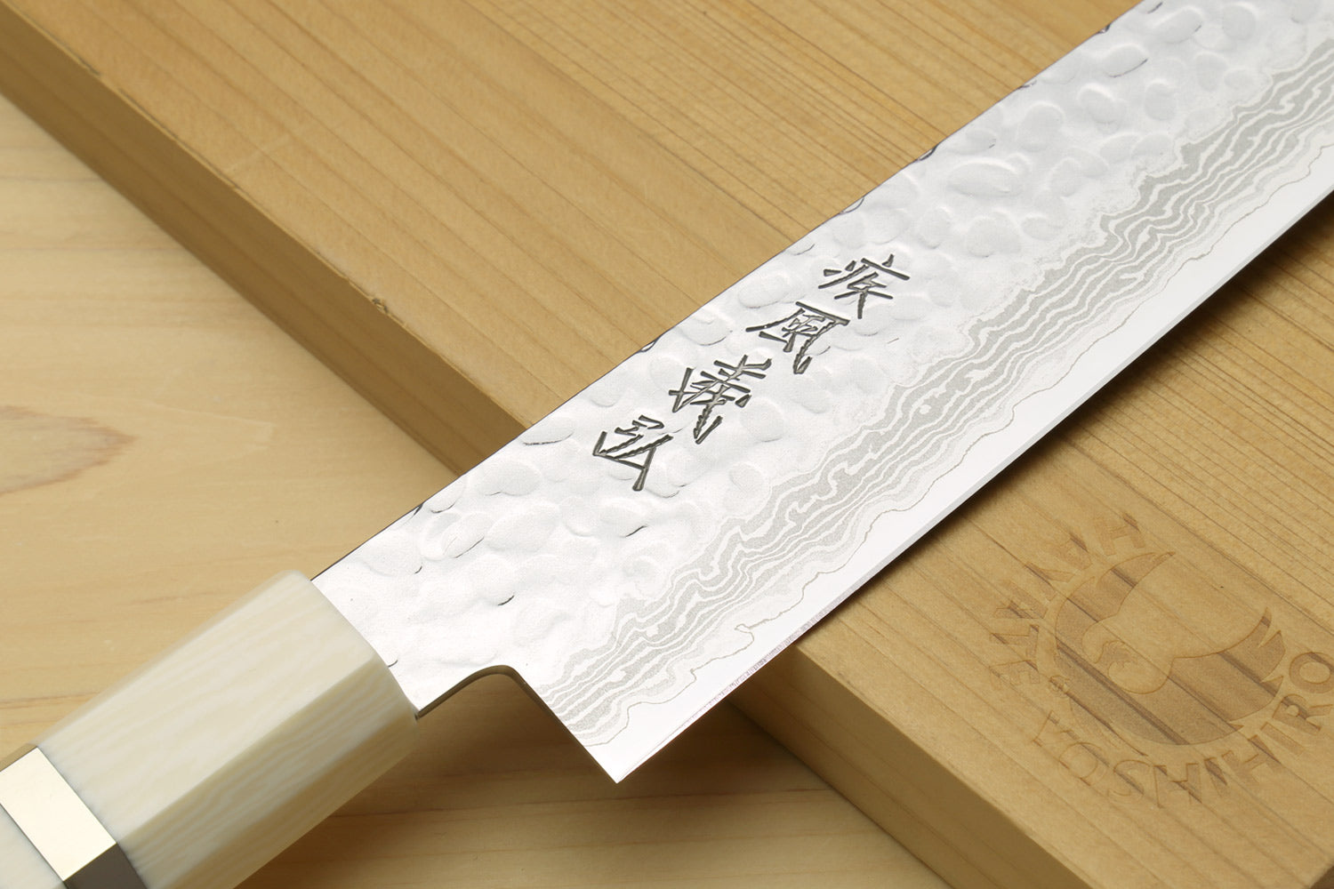 Japanese sujihiki slicer knife, damascus patterned blade with ivory-toned handle
