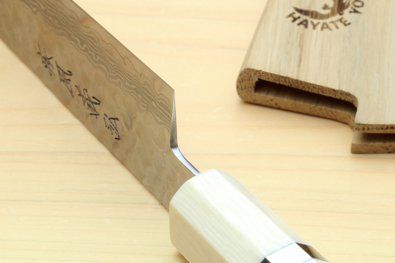 Japanese sujihiki slicer knife, damascus blade with ivory-toned handle