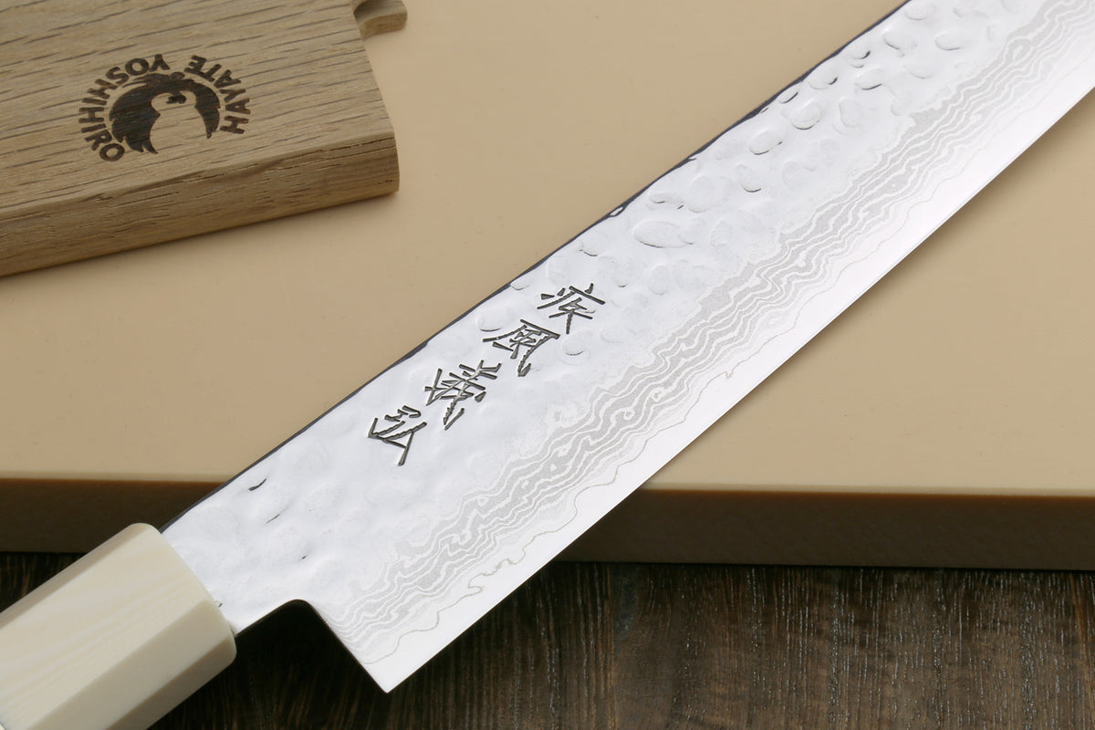 Damascus sujihiki slicer knife with etched characters on hammered blade