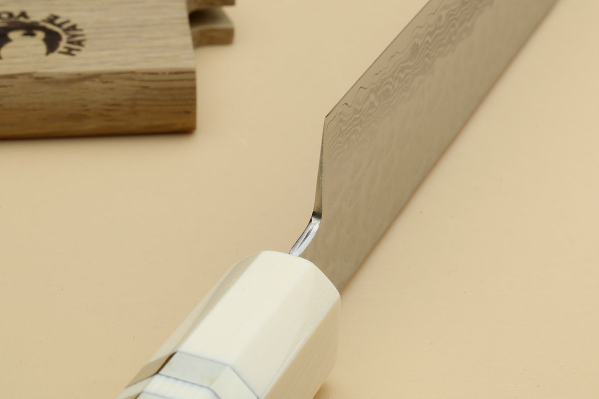 Octagonal rosewood handle with ivory bolster and blade heel