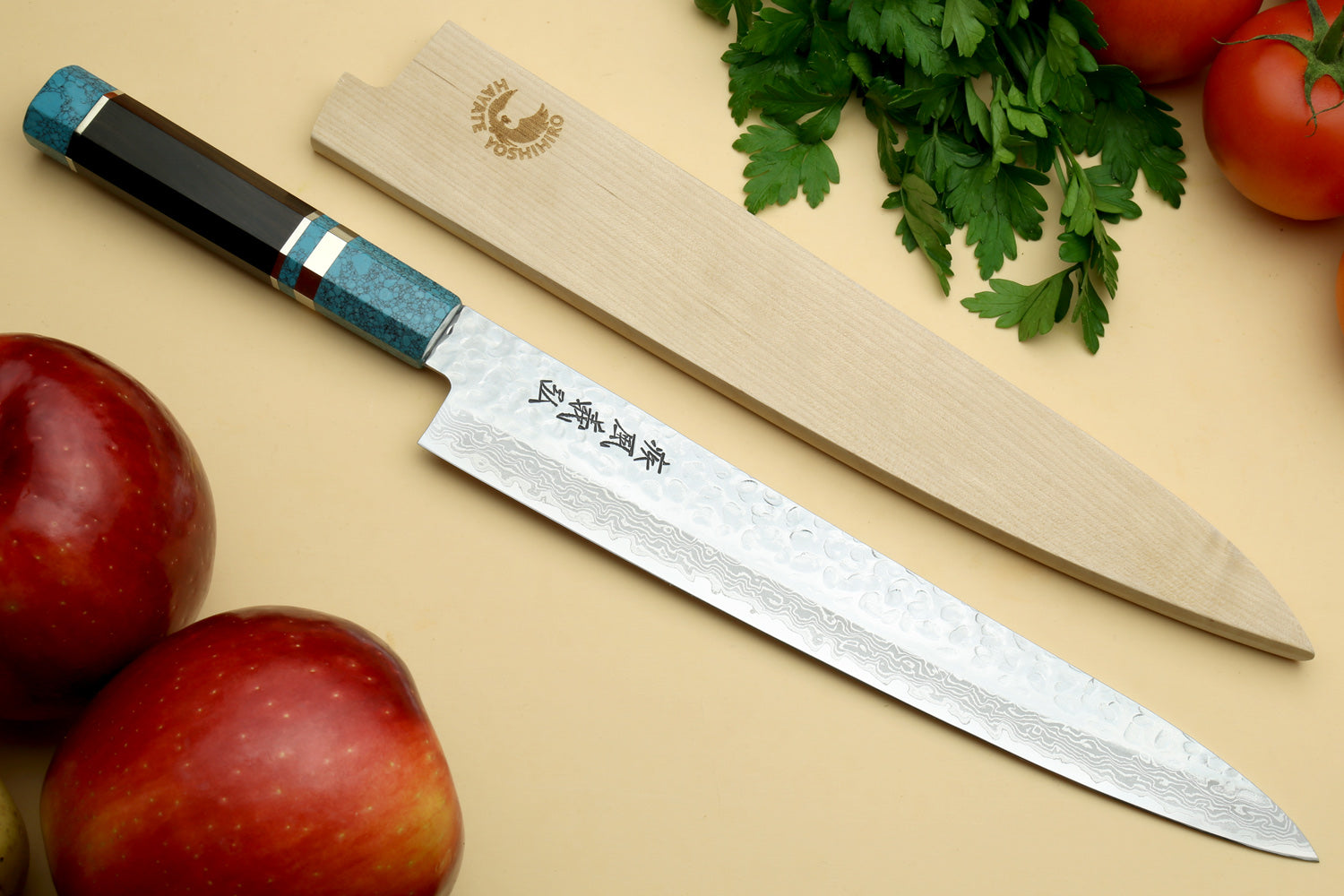 Damascus sujihiki knife with turquoise octagonal handle and engraved silver blade