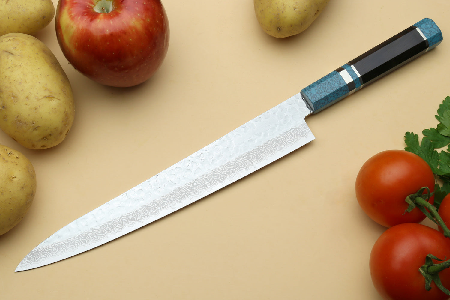 Damascus sujihiki knife with turquoise octagonal handle and long silver blade