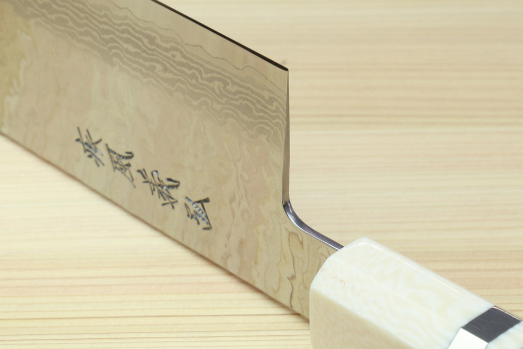 Nakiri vegetable knife blade side with etched characters and light ivory bolster