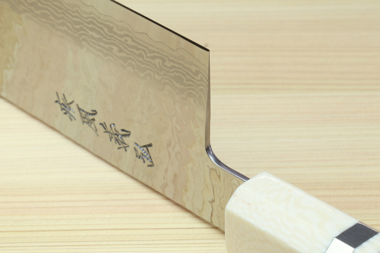 Nakiri vegetable knife blade side with etched characters and light ivory bolster