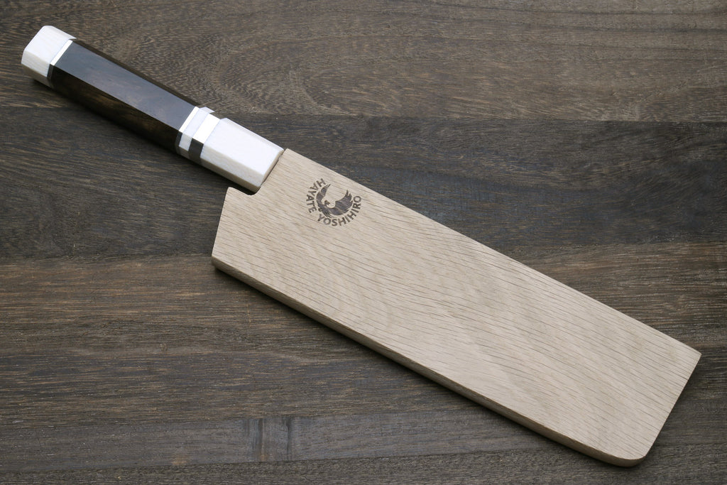 Nakiri vegetable knife with white damascus blade and dark handle, with wooden saya