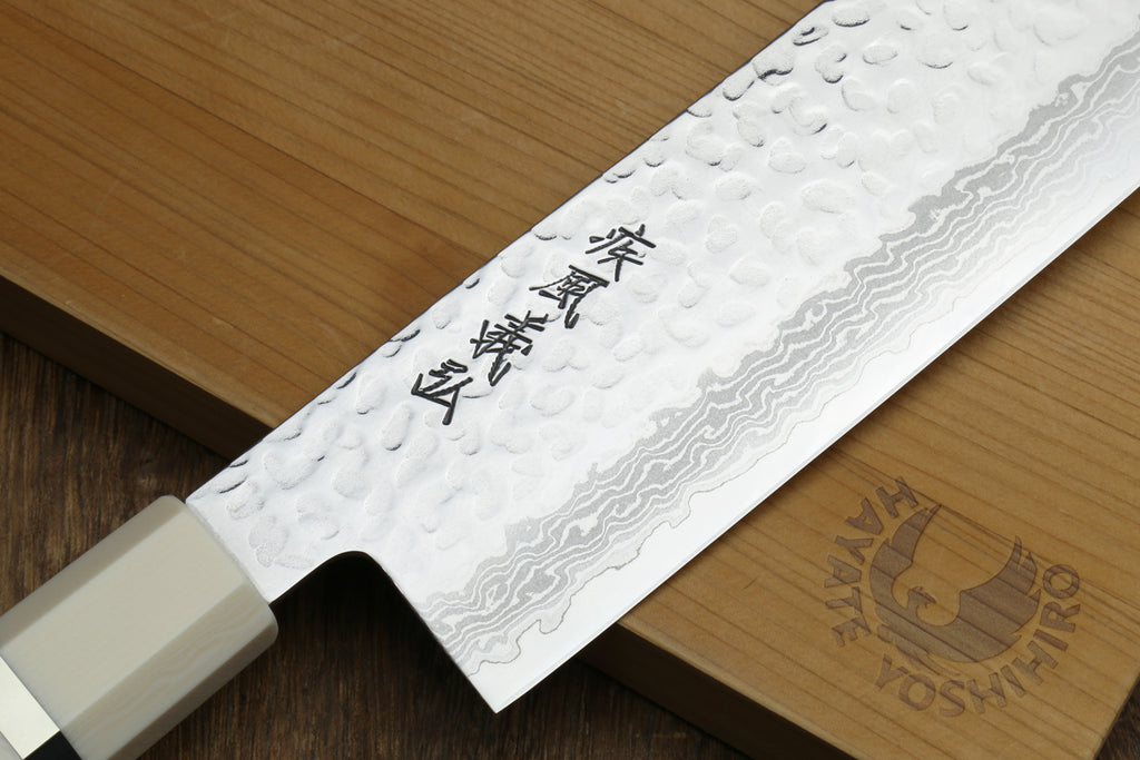 Hammered Damascus nakiri blade with etched kanji and white howlite handle