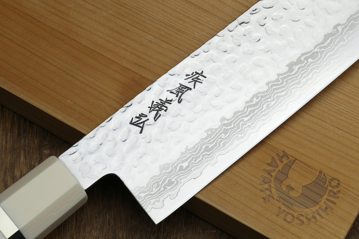 Hammered Damascus nakiri blade with etched kanji and white howlite handle