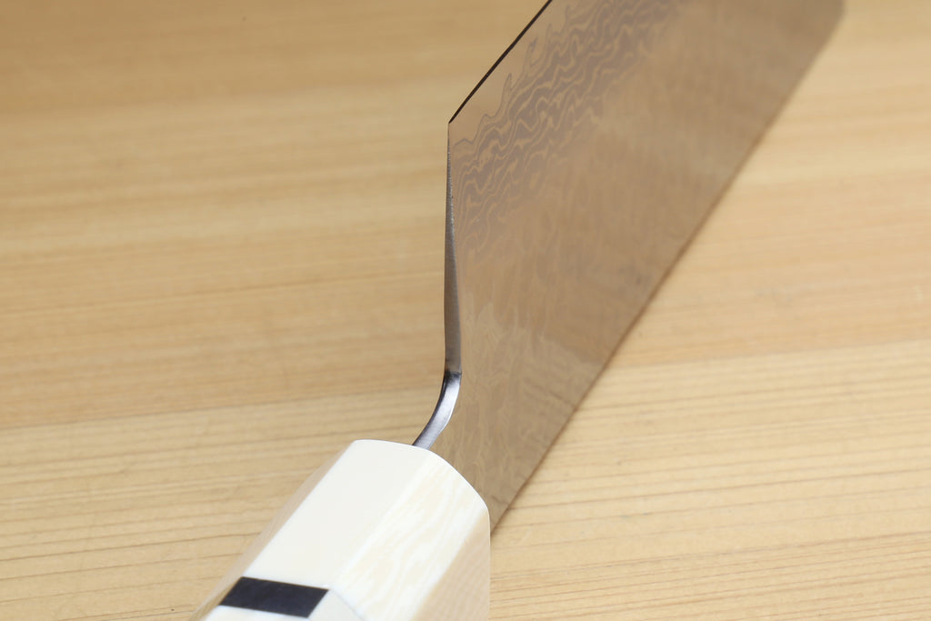 Nakiri knife with white howlite handle and hammered Damascus blade bevel