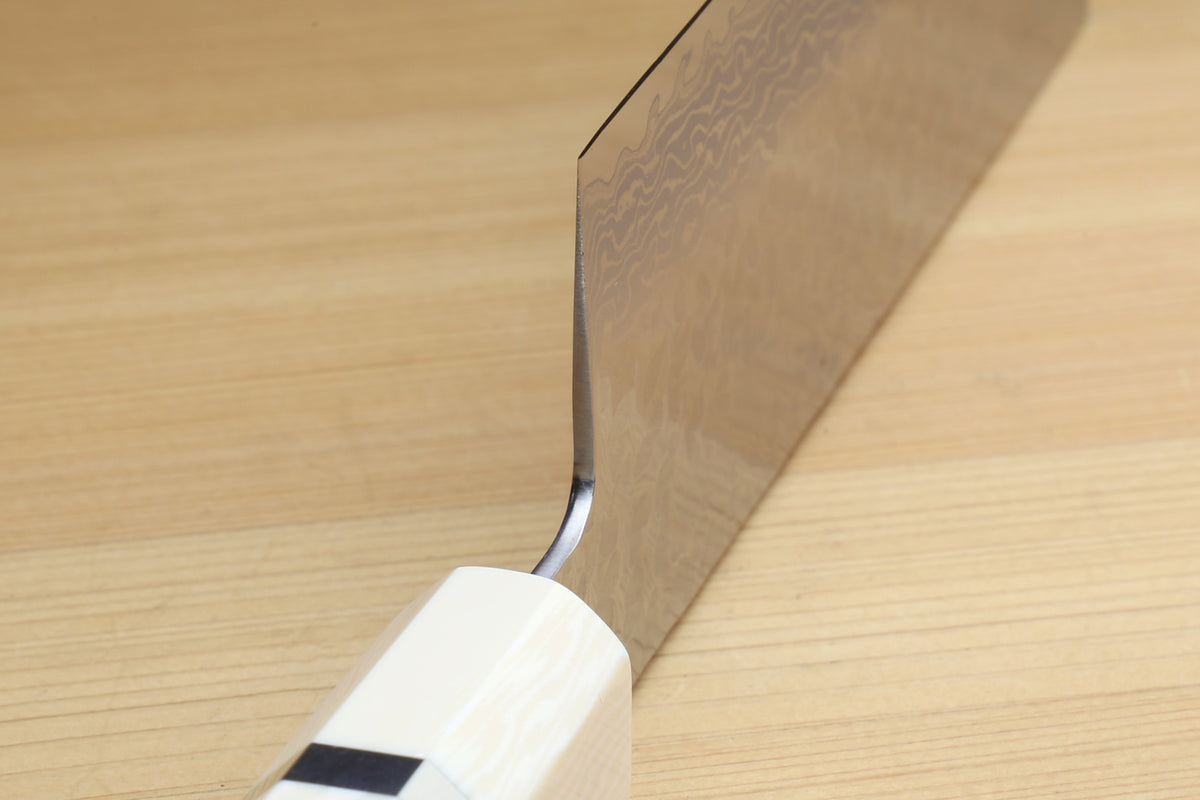 Nakiri knife with white howlite handle and hammered Damascus blade bevel