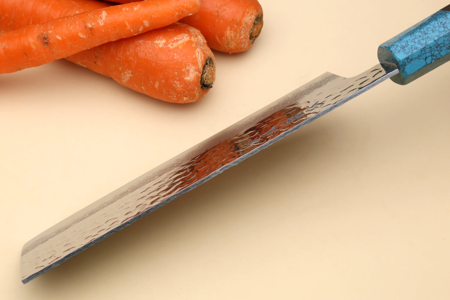 Nakiri vegetable knife side view with damascus blade and turquoise handle with black spacer