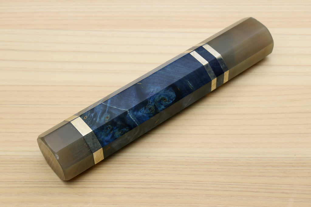 Ocean blue knife handle with horn bolster, striped center wrap, and end cap