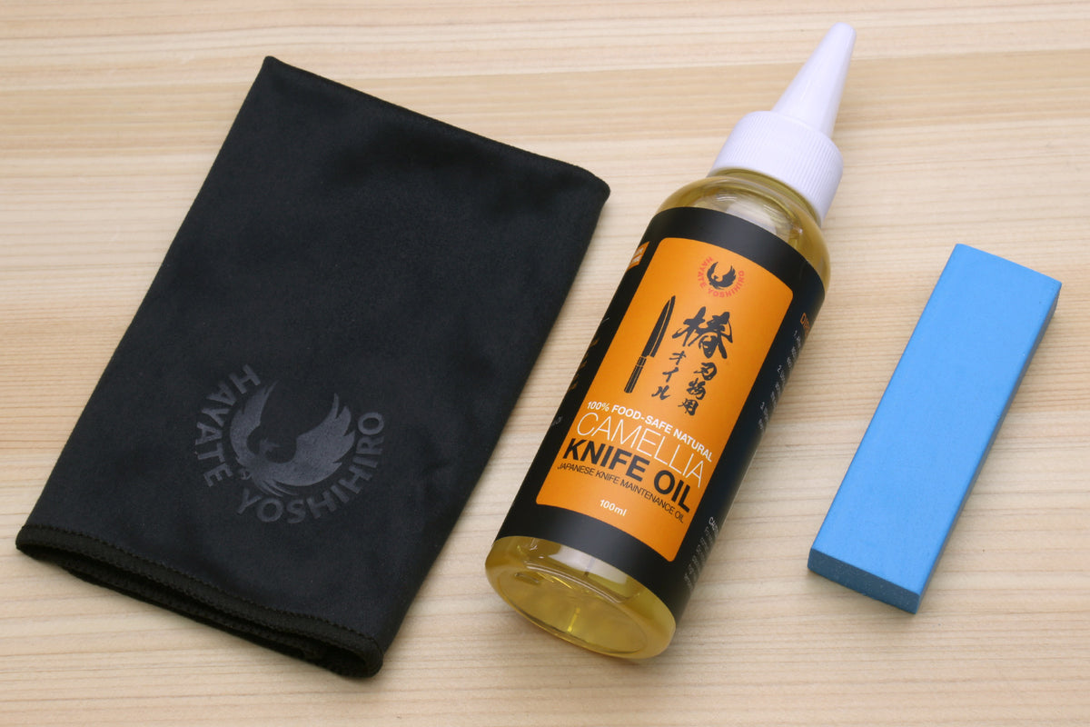 Knife oil care kit: black pouch, oil bottle, blue polishing block
