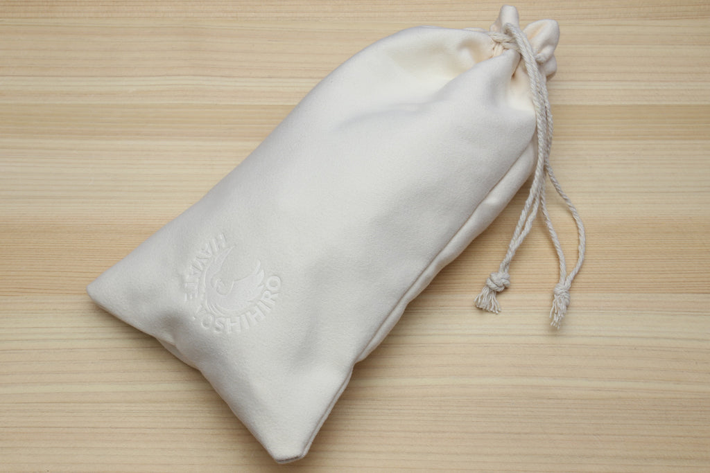 White drawstring storage bag for knife oil care kit items