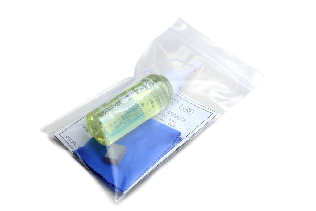 Rust eraser set in pouch: green oil bottle, blue cloth, gray eraser block