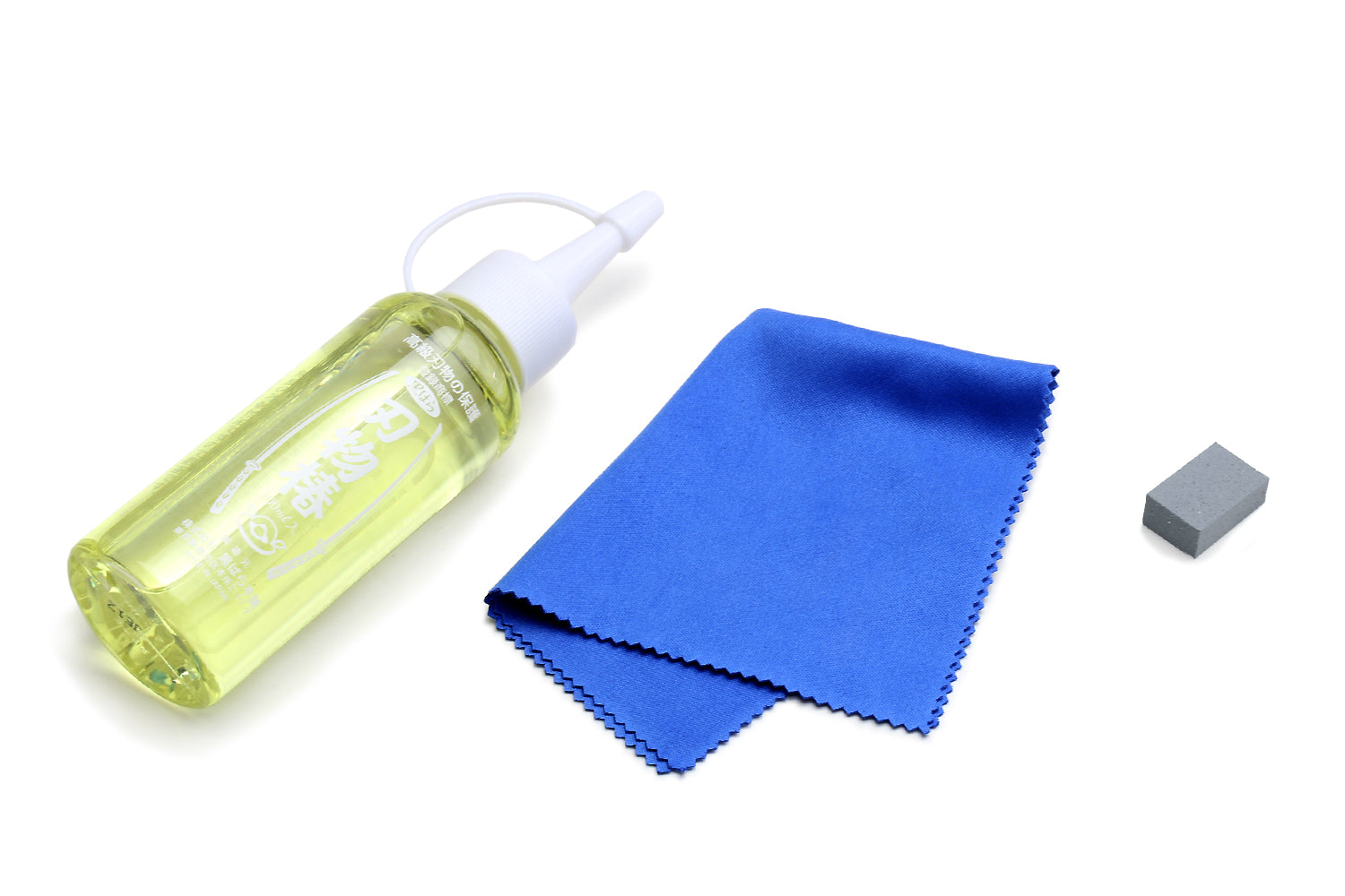 Rust eraser set: green oil bottle with nozzle, blue cloth, gray eraser block