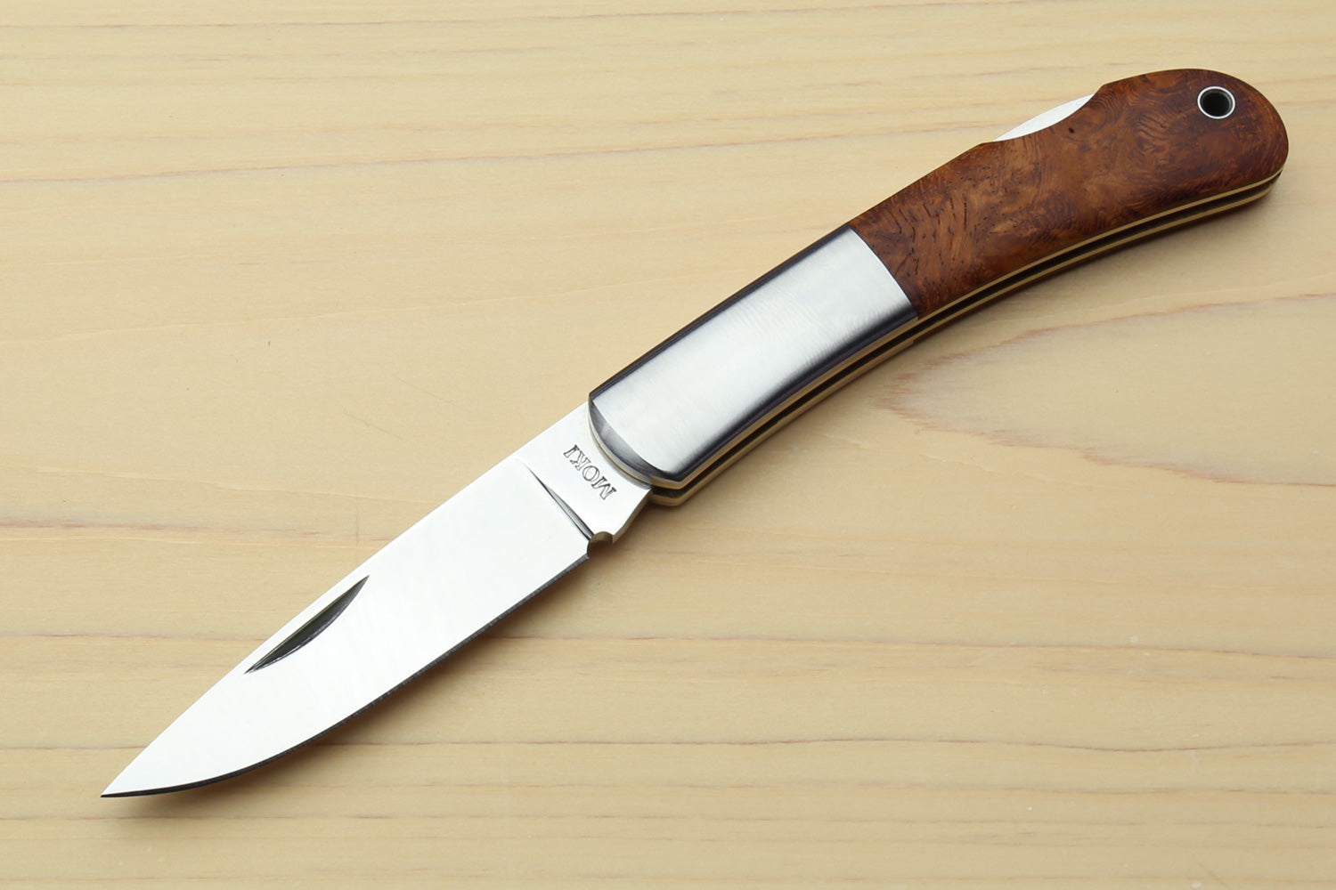 Lockback folding pocket knife with polished steel blade and brown wood handle