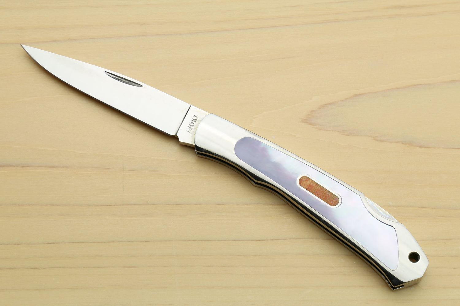Polished stainless steel lockback folding pocket knife with purple abalone inlay handle