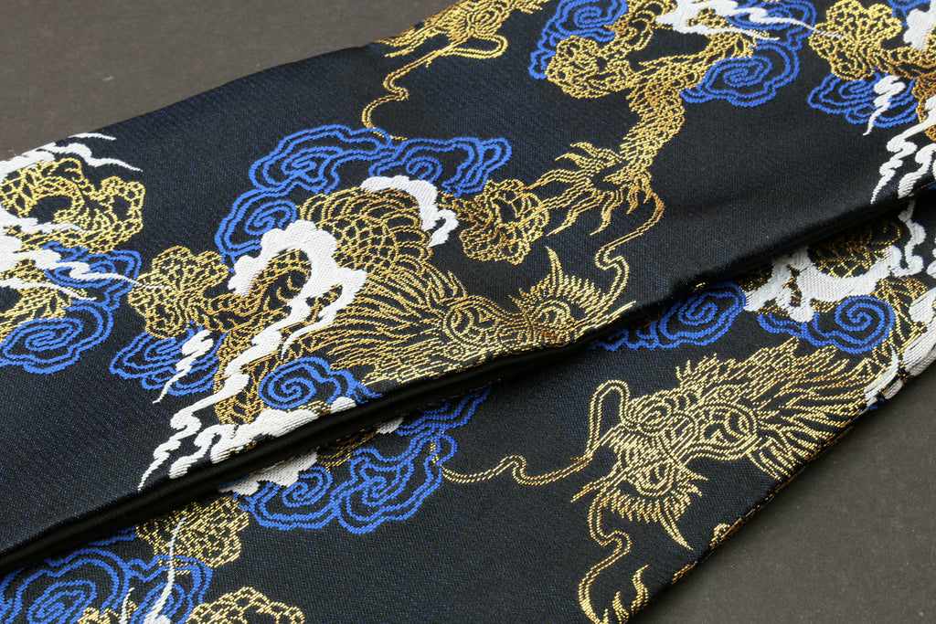 Black dragon-pattern knife pouch bag close-up with gold, blue and white embroidered dragons
