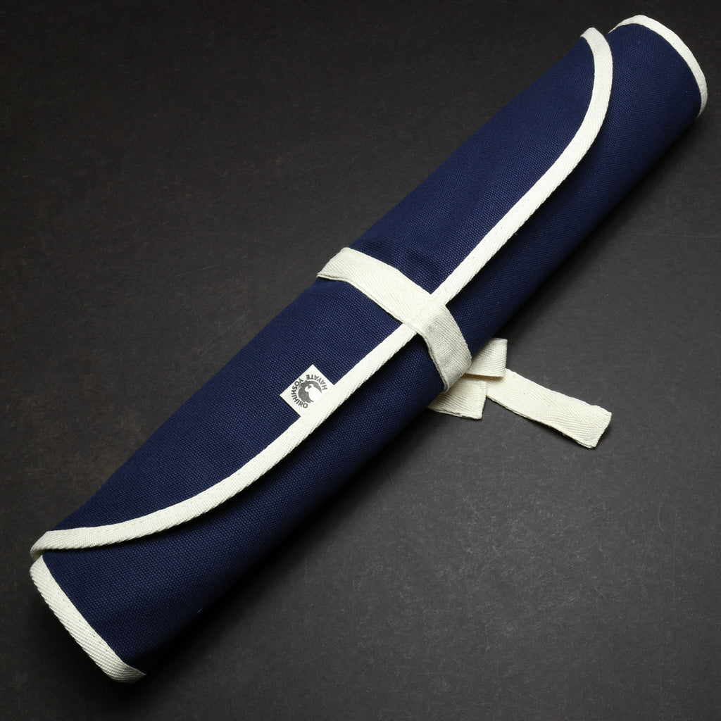 Dark navy cotton knife pouch bag, rolled and secured with a white wrap strap