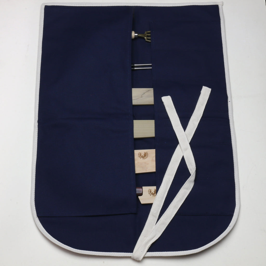 Dark navy cotton knife pouch bag open, showing six slot pockets and white tie closure
