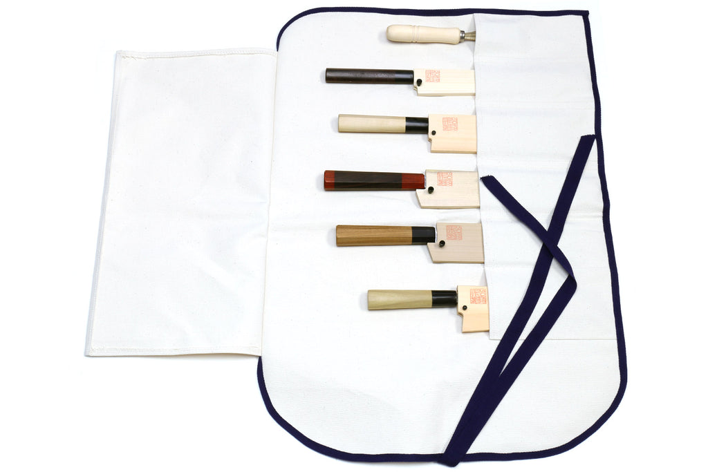 Open white knife pouch bag with navy edging and 6 storage pockets