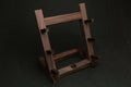 Ebony and rosewood knife rack stand with vertical posts and angled base supports