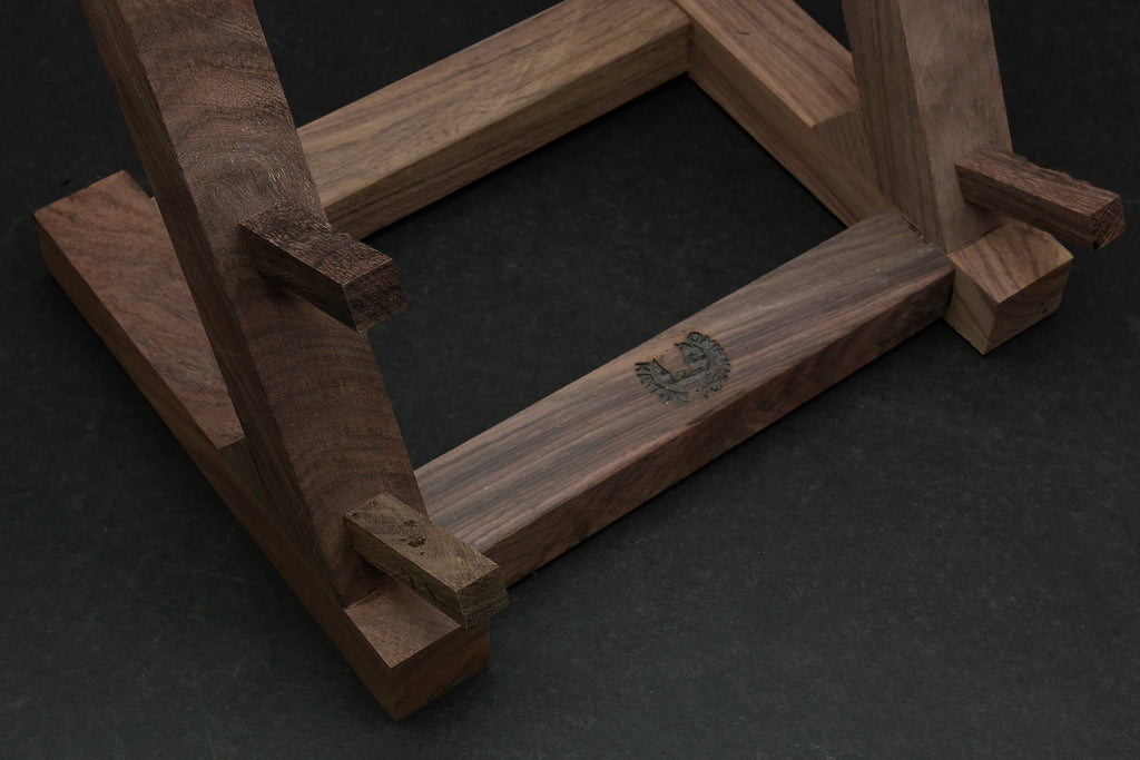 Ebony and rosewood knife rack stand close-up of wooden frame and slot openings