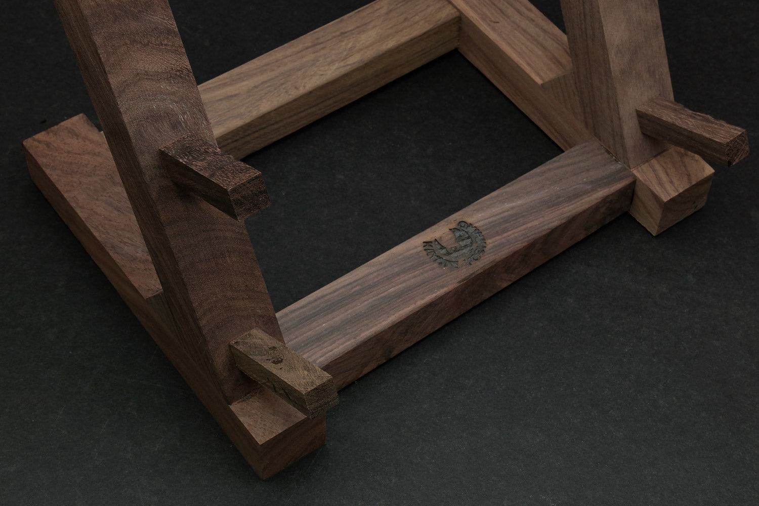 Ebony and rosewood knife rack stand close-up of wooden frame and slot openings