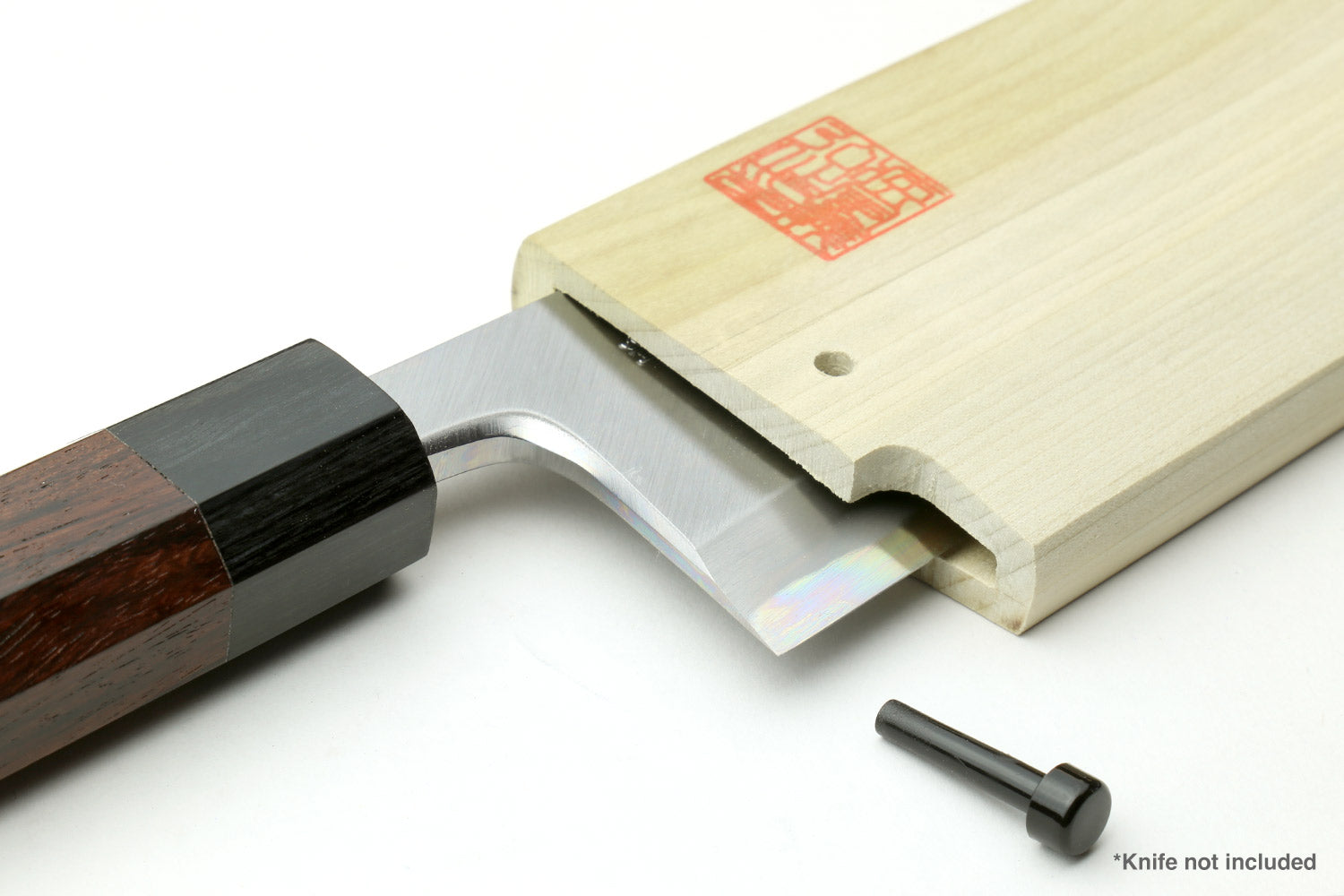 Natural wooden saya knife cover holding a knife blade; red stamp and black pin visible