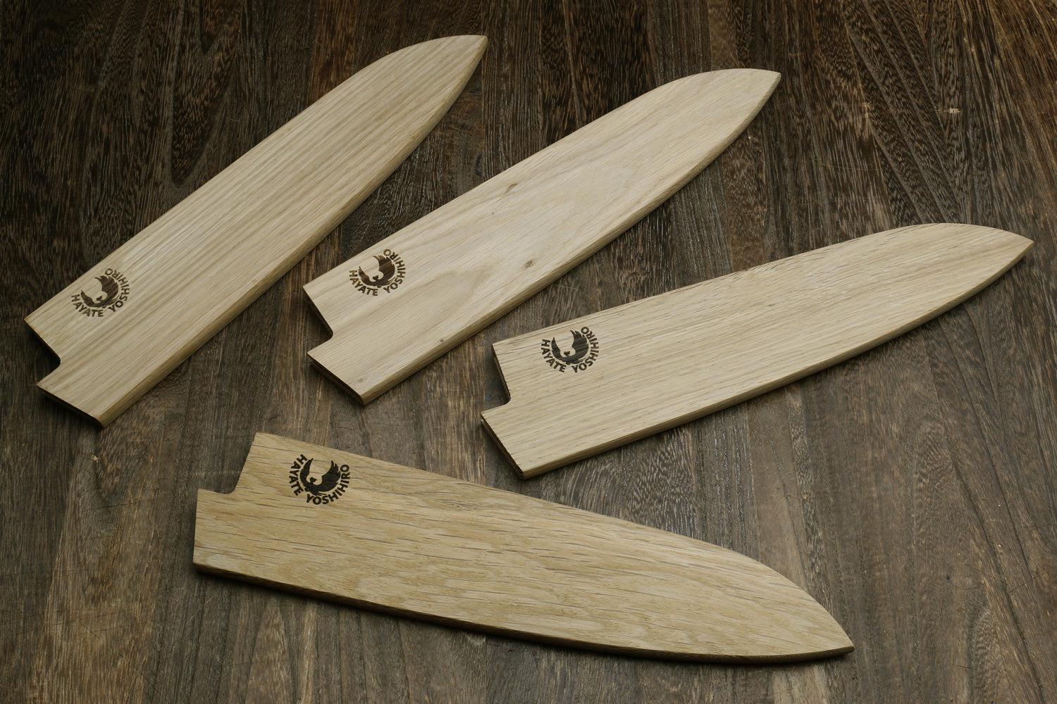 Set of light oak wood saya blade protectors with engraved logos